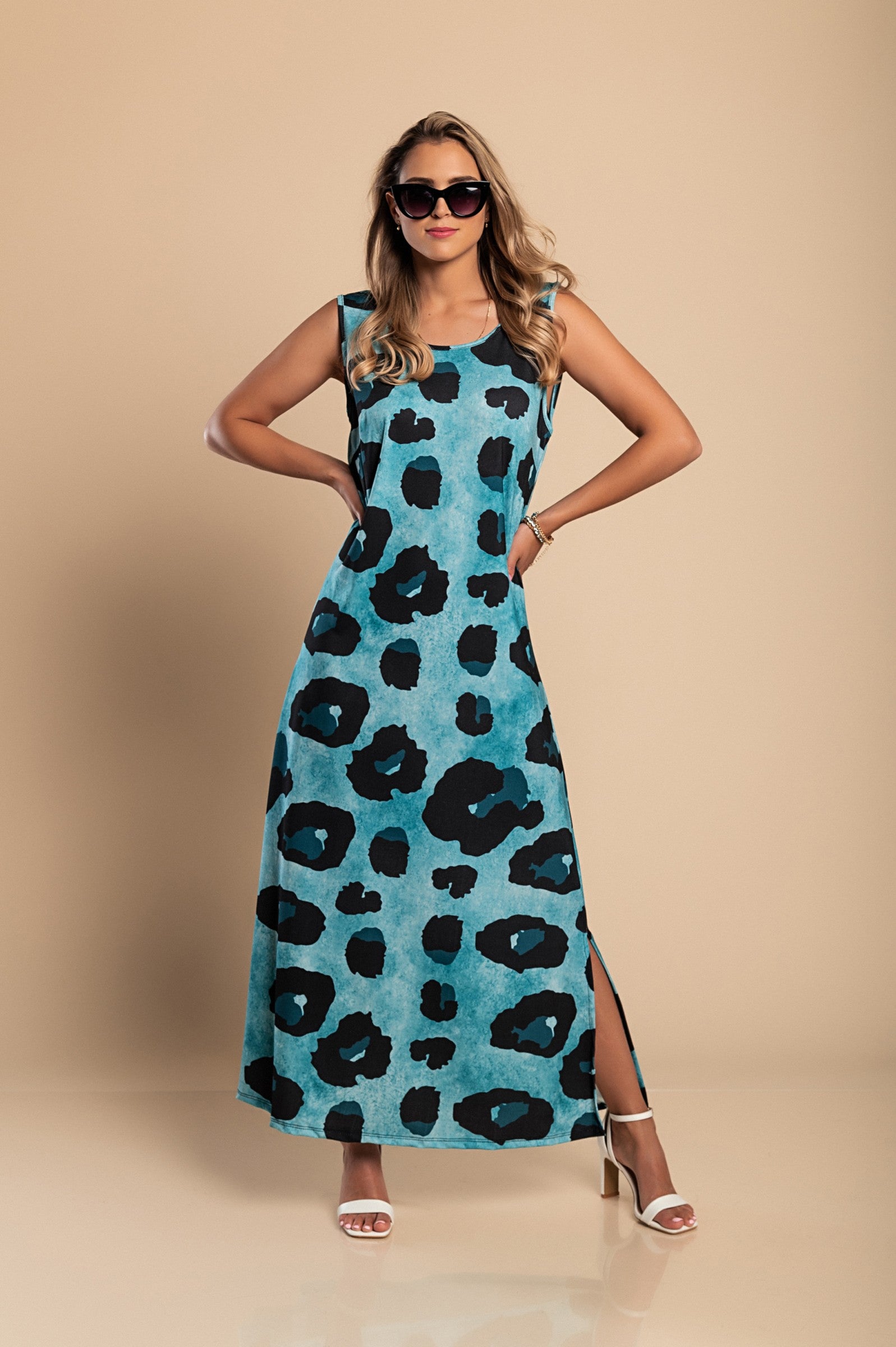 Elegant blue leopard print maxi dress with a round neckline and side slit, made from lightweight fabric.