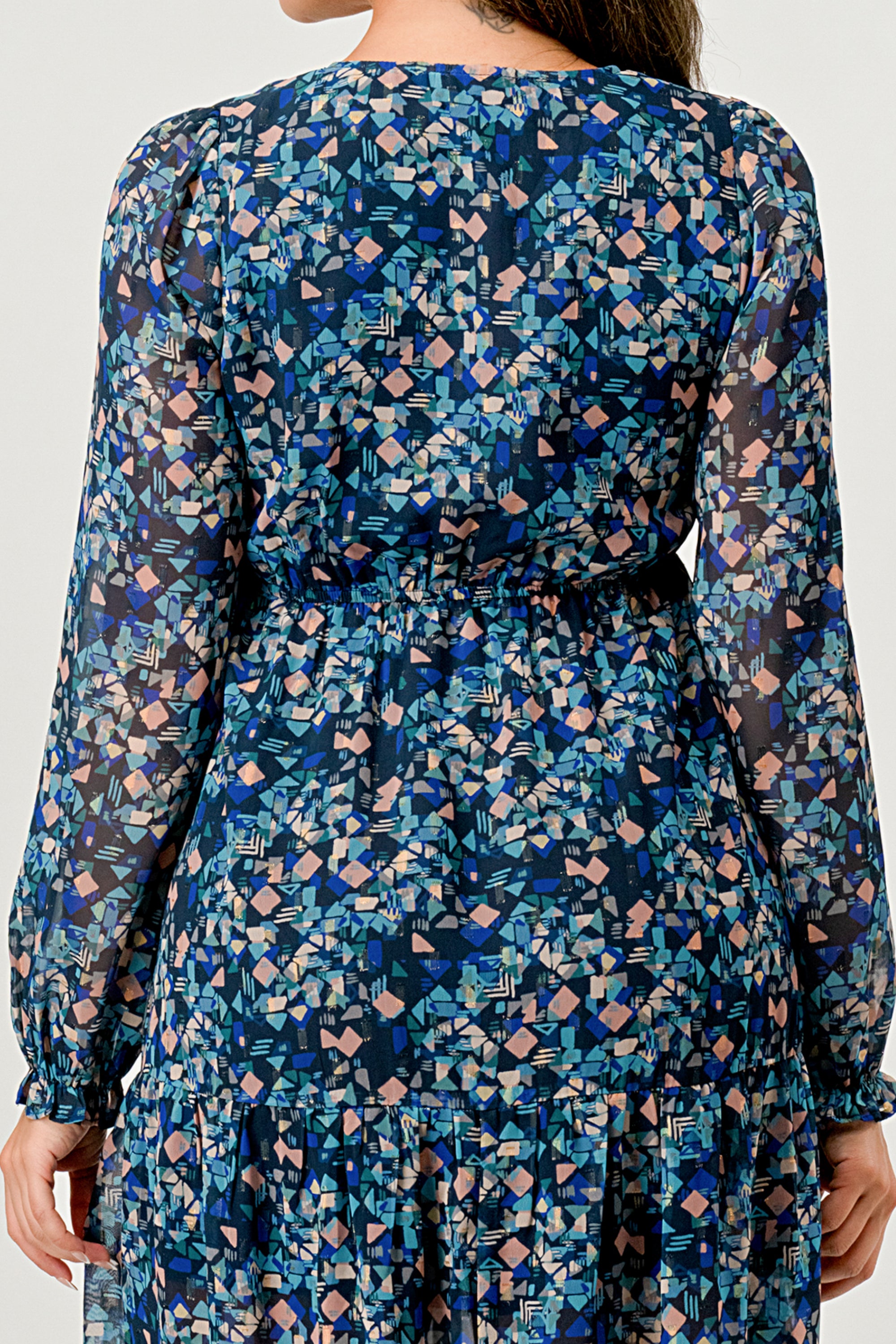 A beautiful floral print maxi dress featuring long sleeves, a V neck, and a stylish side slit, perfect for any occasion.