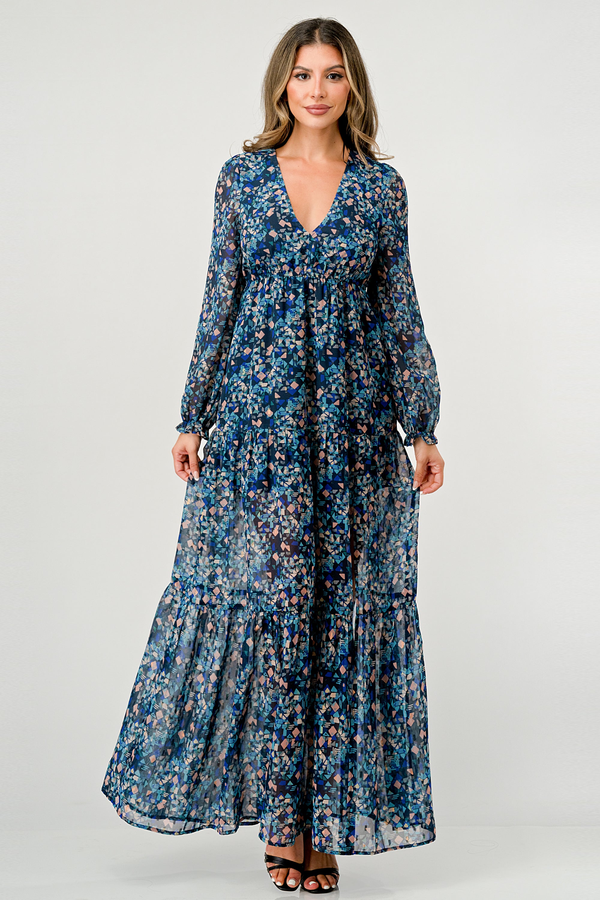A beautiful floral print maxi dress featuring long sleeves, a V neck, and a stylish side slit, perfect for any occasion.
