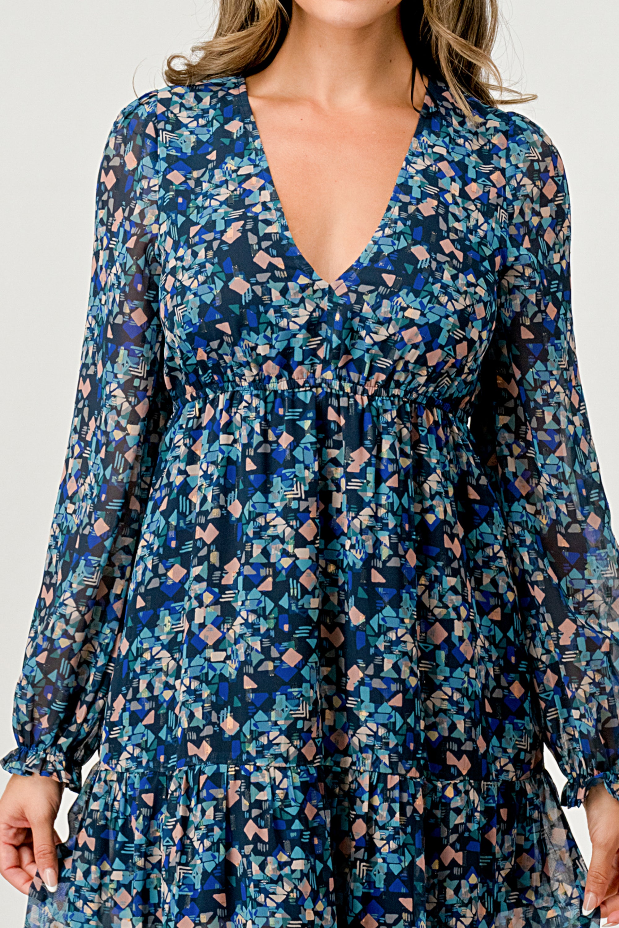 A beautiful floral print maxi dress featuring long sleeves, a V neck, and a stylish side slit, perfect for any occasion.
