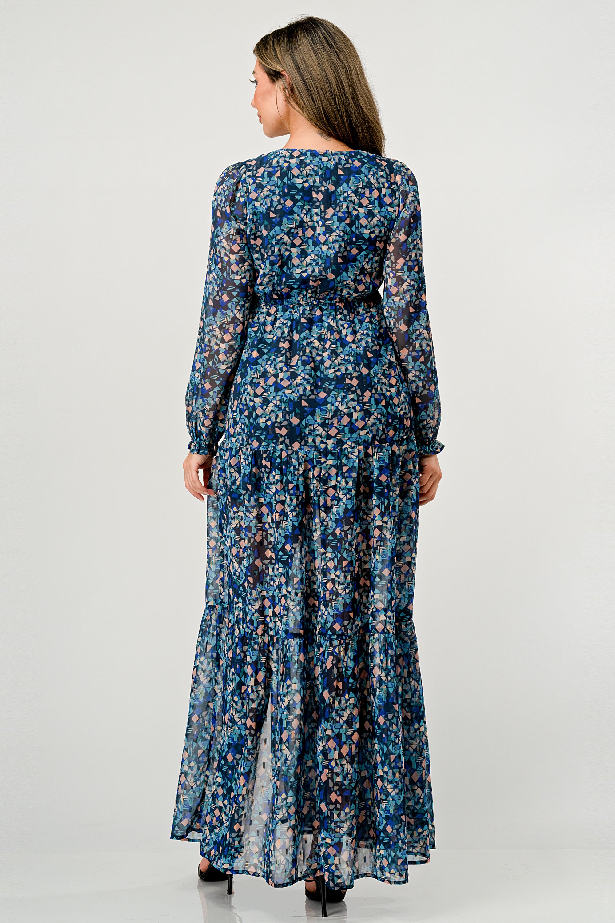 A beautiful floral print maxi dress featuring long sleeves, a V neck, and a stylish side slit, perfect for any occasion.