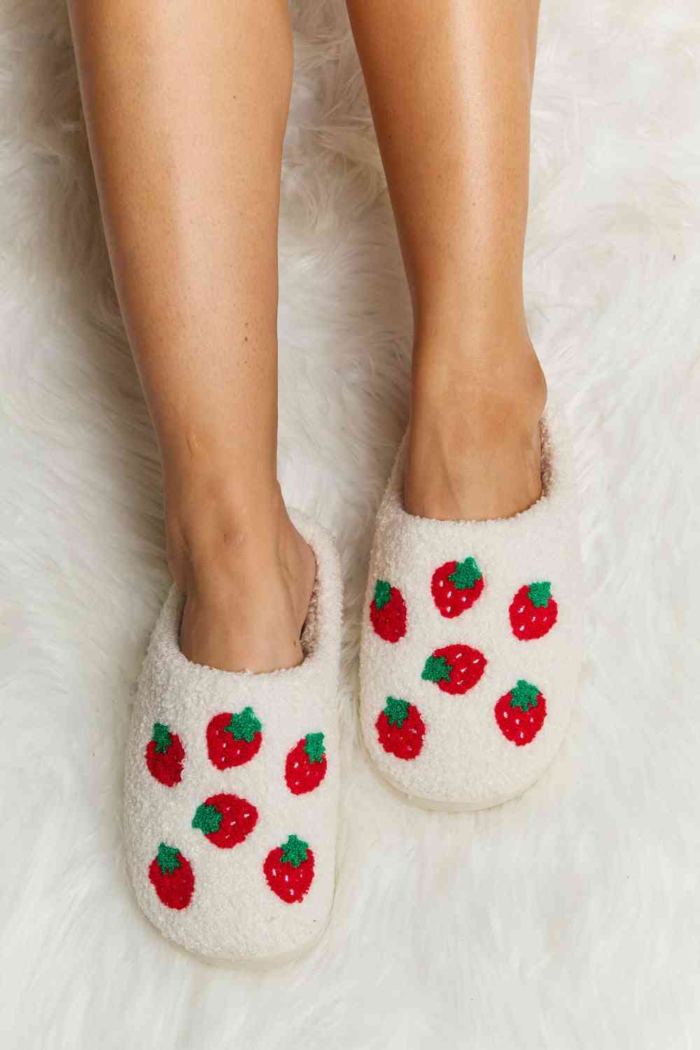 Cozy Melody Printed Plush Slide Slippers with soft fleece lining and charming patterns, perfect for winter lounging.