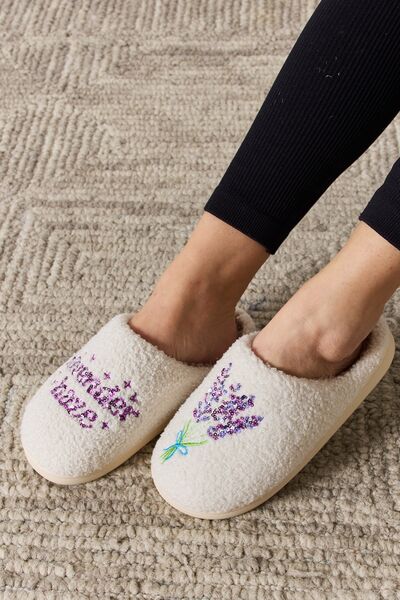 Cozy Melody Sequin Pattern Slippers with plush material and festive design, perfect for winter wear.