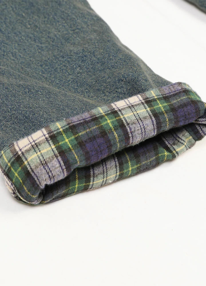 Men's flannel lined jeans with plaid lining and straight leg fit, showcasing a stylish and cozy design.