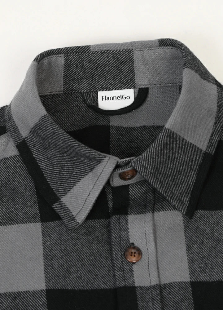 Men's Stalwart Heavyweight Flannel Shirt in plaid pattern, showcasing its relaxed fit and premium fabric.
