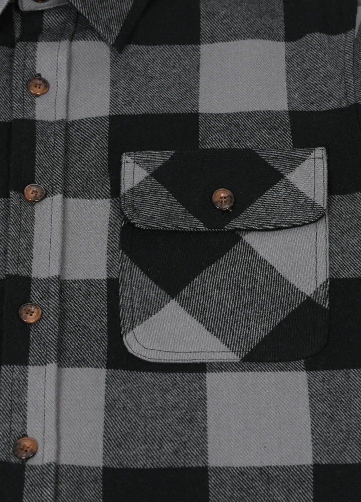 Men's Stalwart Heavyweight Flannel Shirt in plaid pattern, showcasing its relaxed fit and premium fabric.