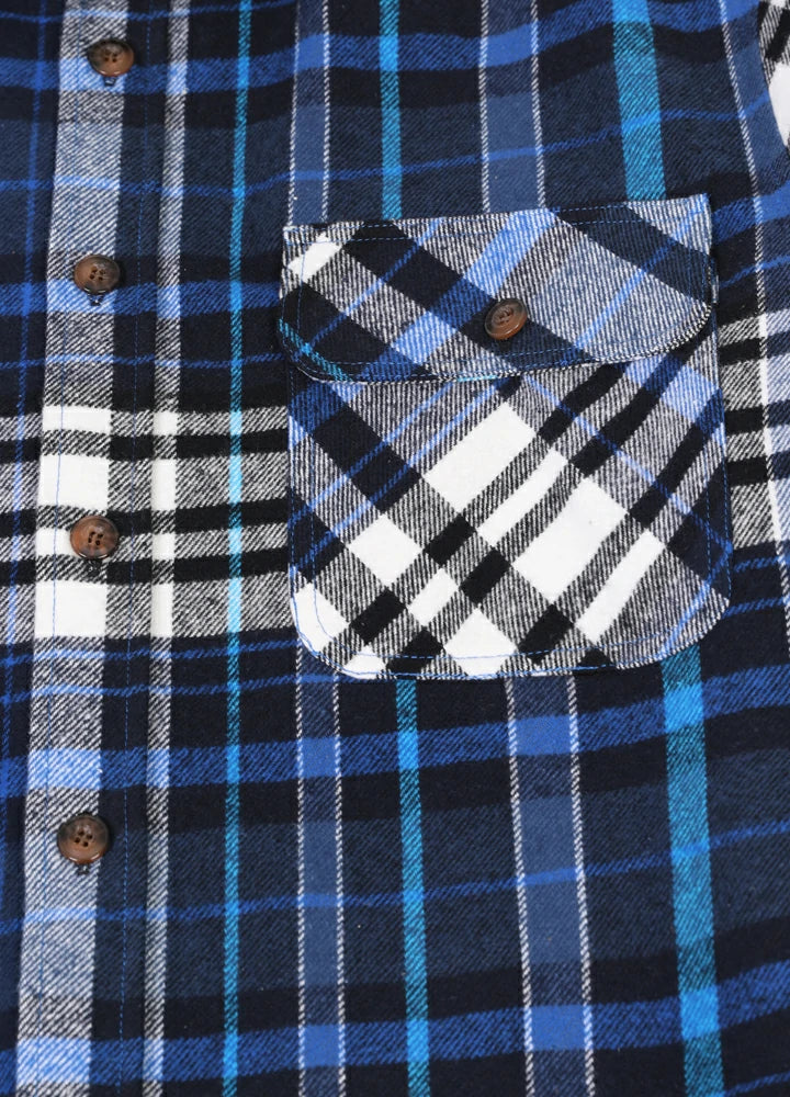 Men's Stalwart Heavyweight Flannel Shirt in plaid pattern, showcasing its relaxed fit and premium fabric.