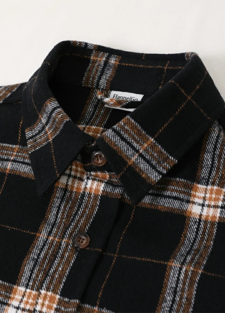 Men's Stalwart Heavyweight Flannel Shirt in plaid pattern, showcasing its relaxed fit and premium fabric.