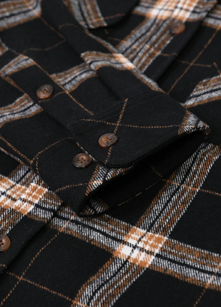 Men's Stalwart Heavyweight Flannel Shirt in plaid pattern, showcasing its relaxed fit and premium fabric.