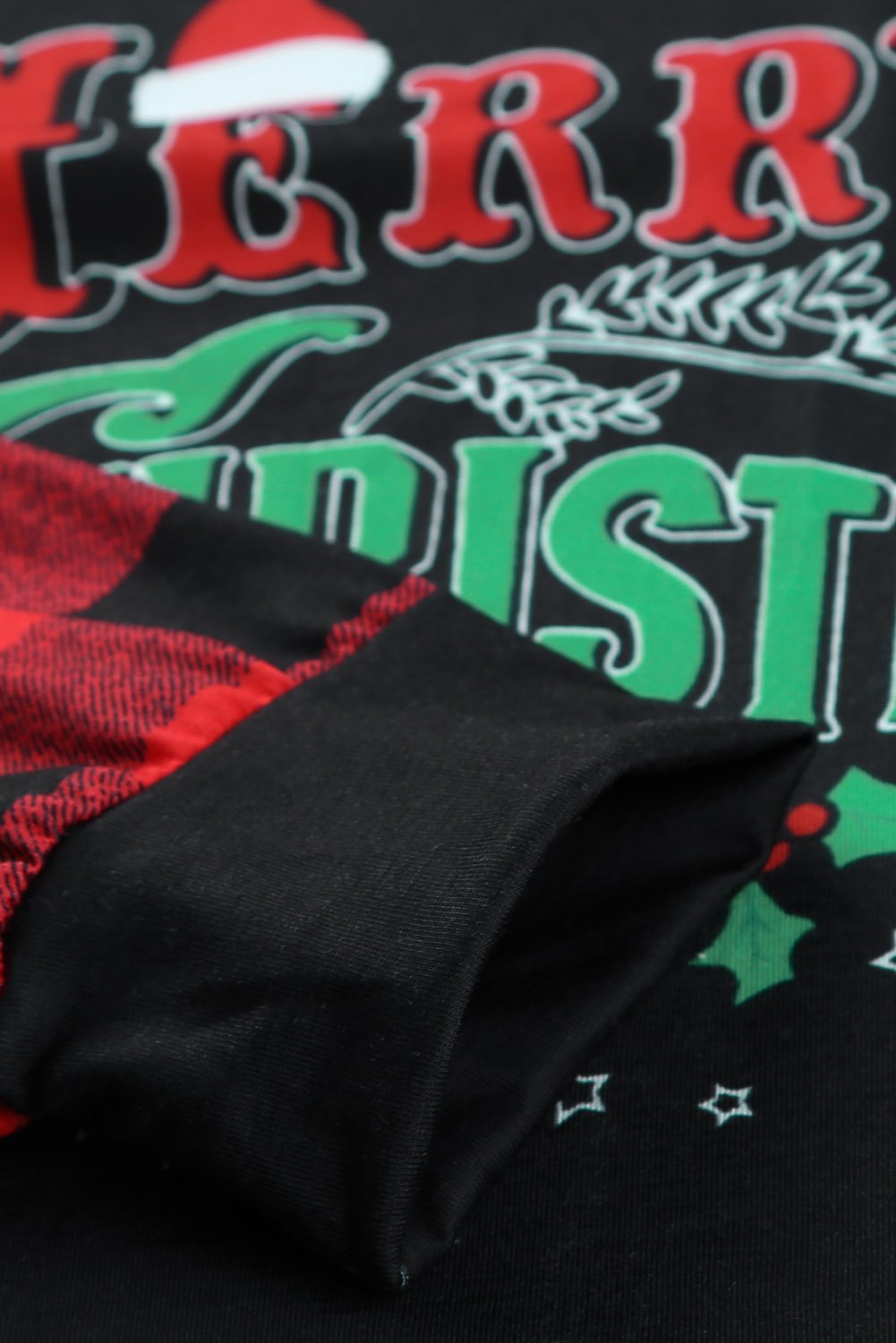 Merry Christmas Gray Long Sleeve Top featuring holiday-themed graphic and buffalo check sleeves.