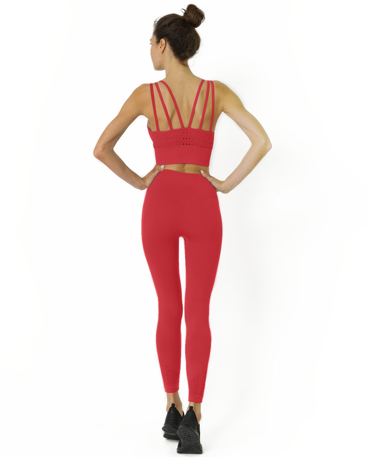 Woman wearing red workout outfit.
