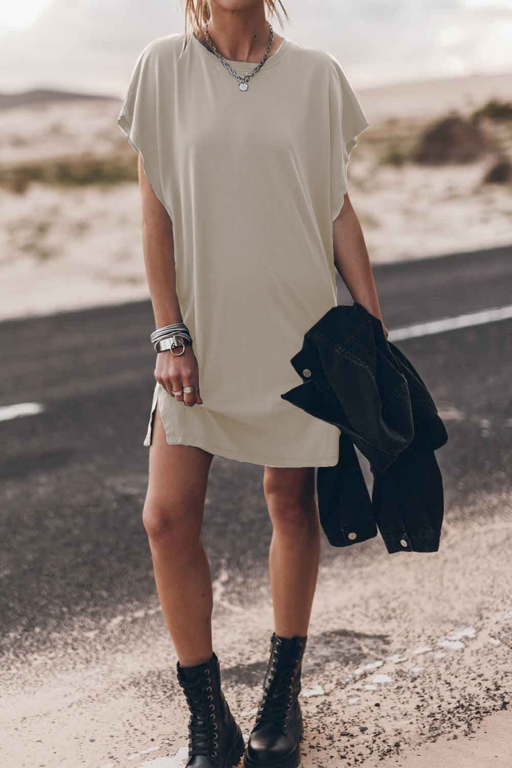 Beige mini dress with loose sleeves and round neckline, showcasing its comfortable fit and stylish design.