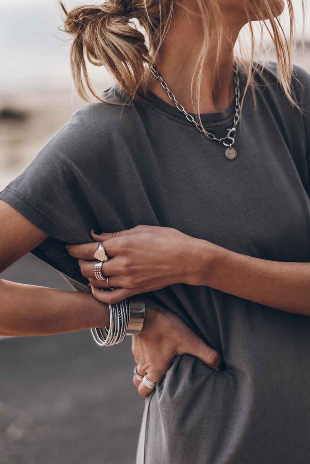 Gray mini dress with loose sleeves and round neckline, showcasing a comfortable and stylish design.