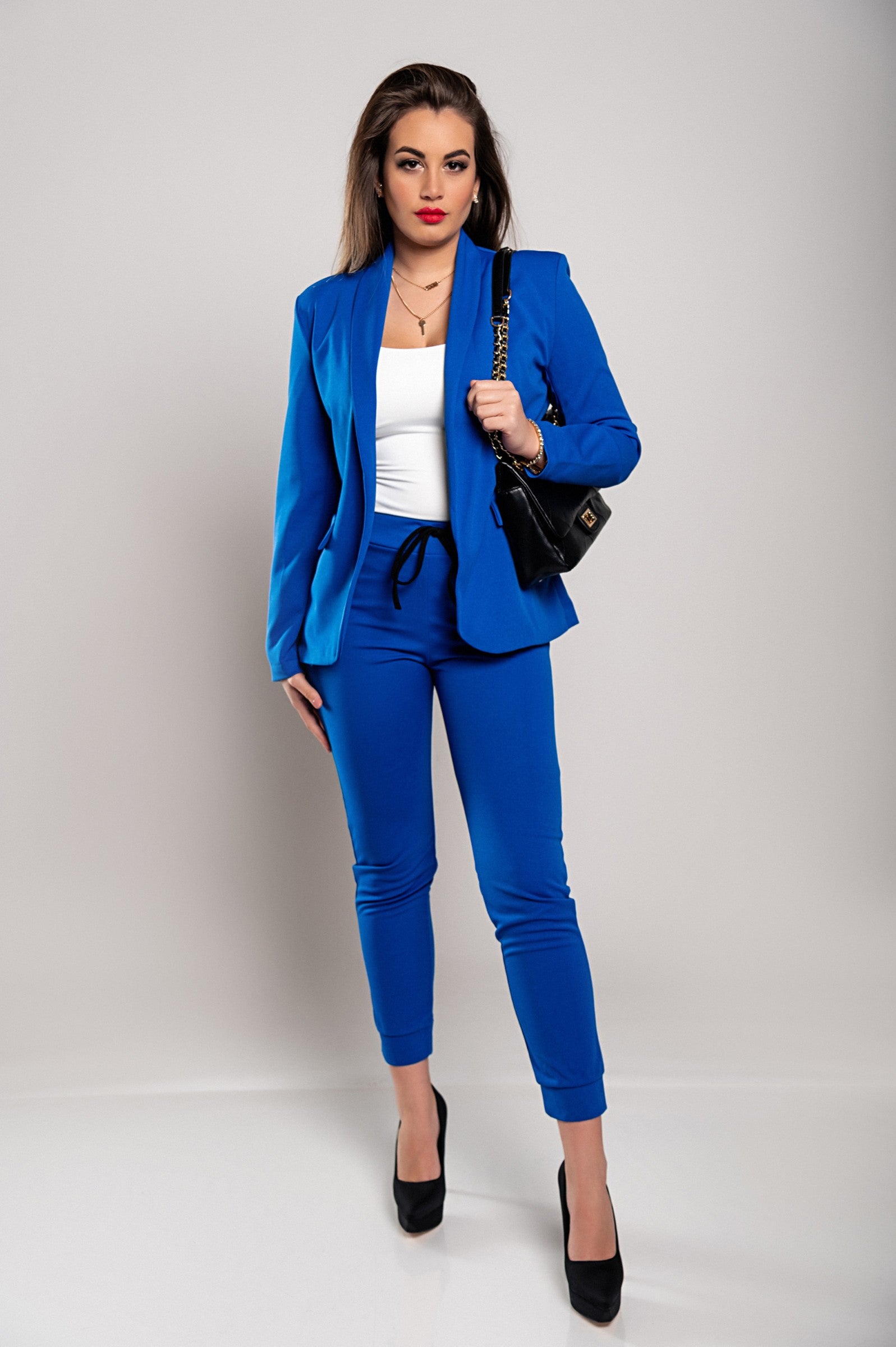 Monochrome elegant trousers and blazer set Estrena in blue, showcasing a stylish blazer with long sleeves and slim fit trousers.
