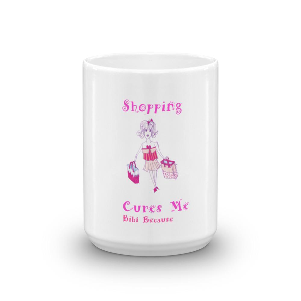 A glossy white ceramic mug with the phrase 'Because Shopping Cures Me' printed in vibrant colors, perfect for coffee or tea.