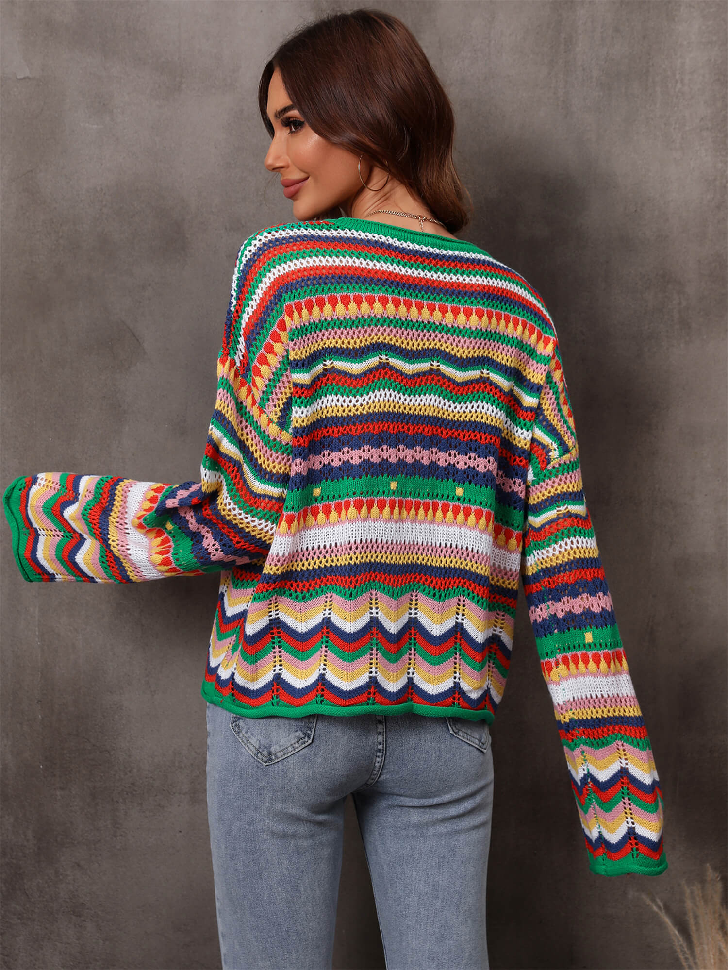A stylish multicolored stripe openwork knit top featuring a round neck and long sleeves with dropped shoulders, made from soft acrylic material.