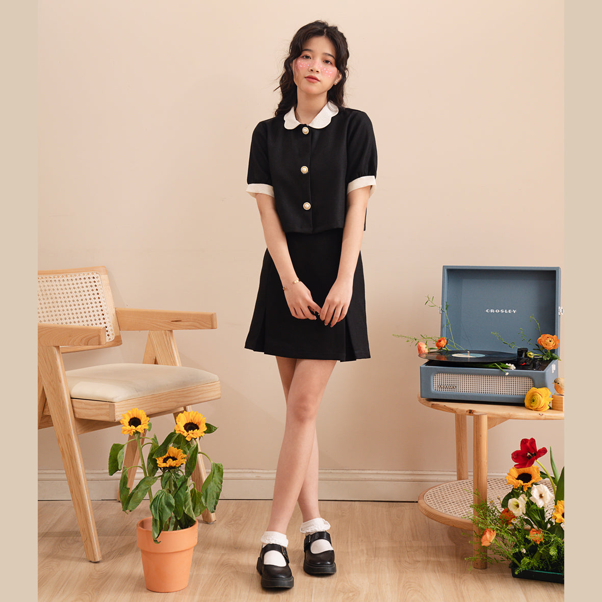 A stylish Naomi Skirt displayed on a model, showcasing its above-the-knee length and regular fit, perfect for various occasions.