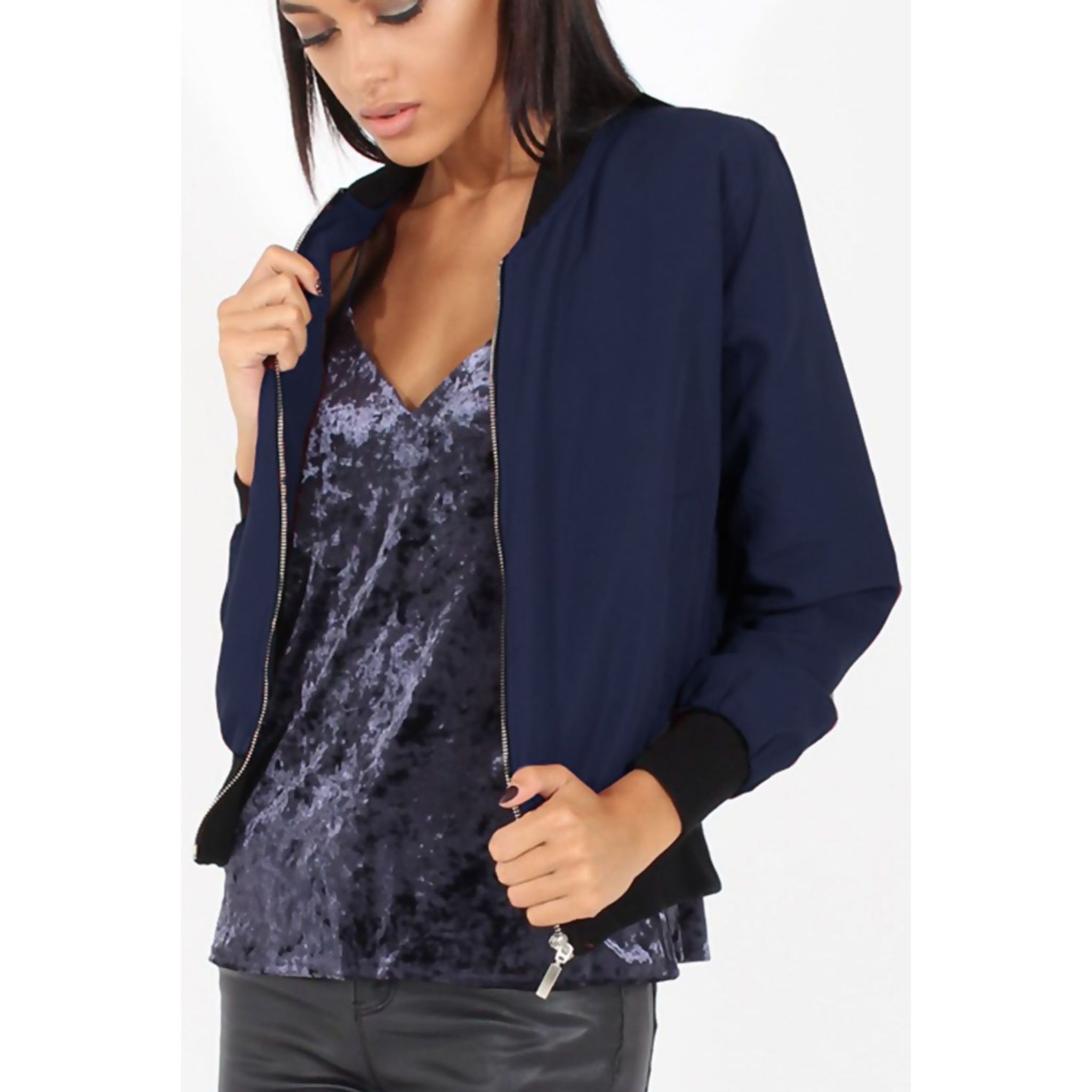 Navy blue bomber jacket for women featuring a classic biker style with ribbed cuffs and zip-up front.