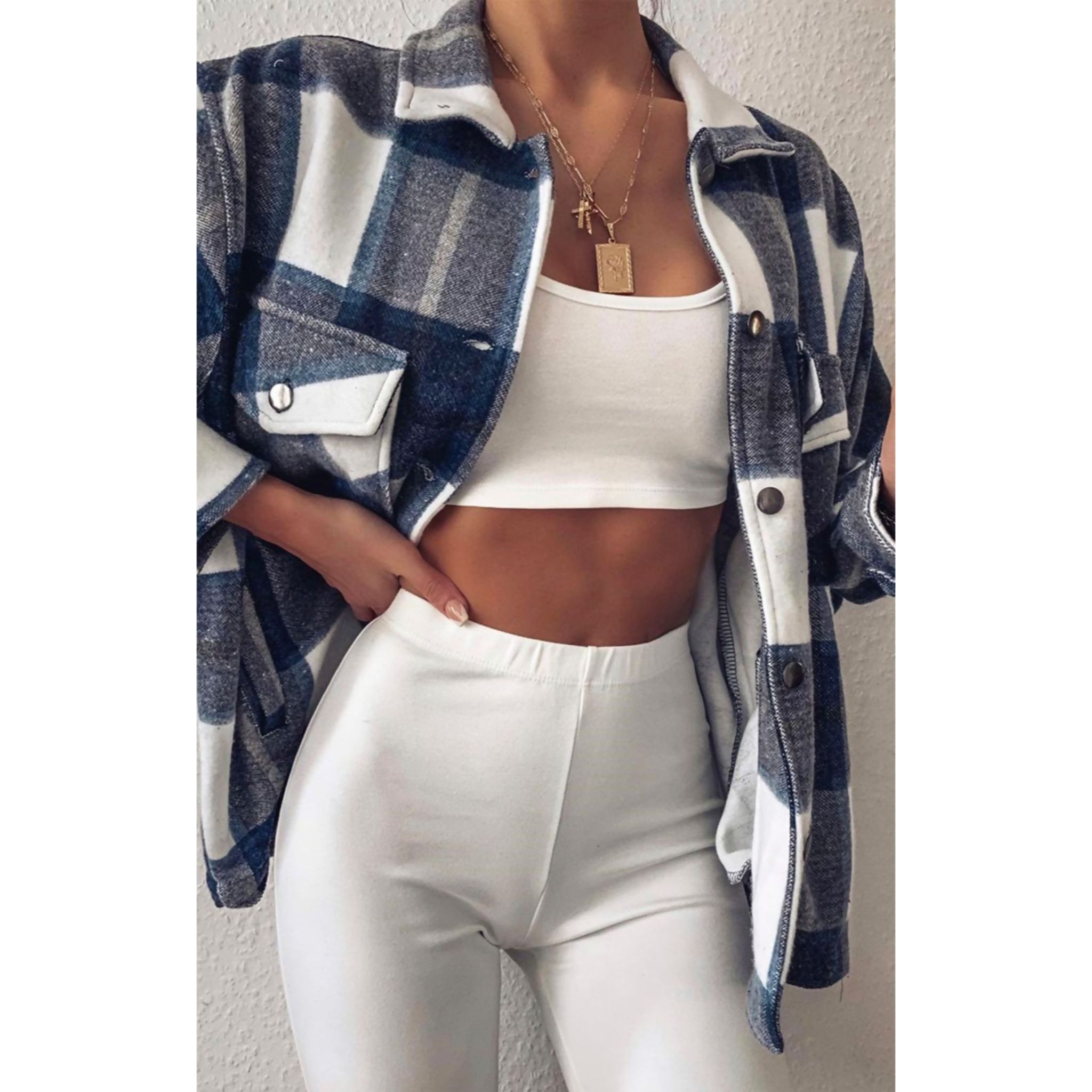 A pair of navy checked joggers for women featuring a light pink check print, high elasticated waist, and side pockets.