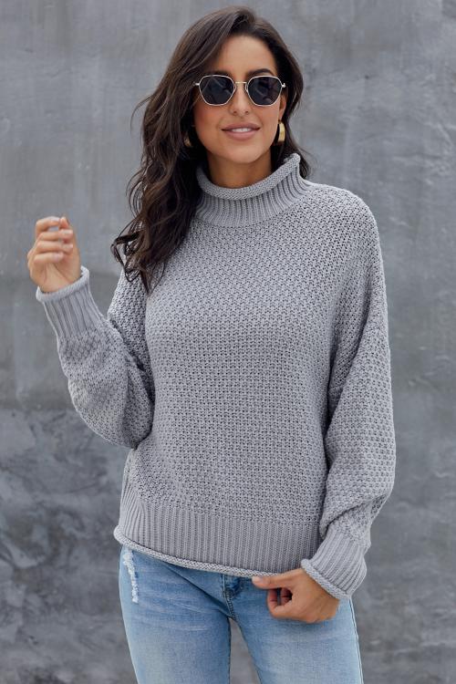 A stylish gray chunky batwing long sleeve turtleneck sweater, showcasing its oversized design and soft fabric, perfect for winter wear.