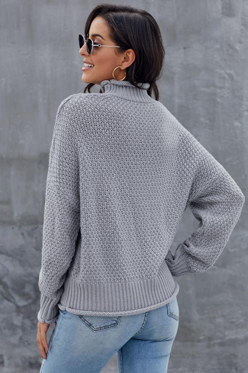 A stylish gray chunky batwing long sleeve turtleneck sweater, showcasing its oversized design and soft fabric, perfect for winter wear.