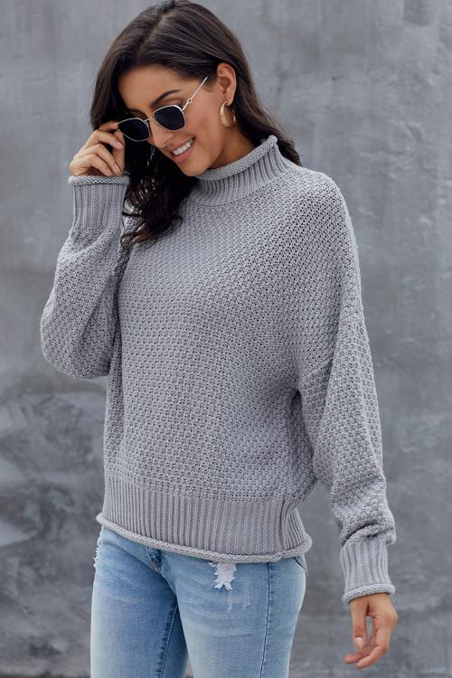 A stylish gray chunky batwing long sleeve turtleneck sweater, showcasing its oversized design and soft fabric, perfect for winter wear.