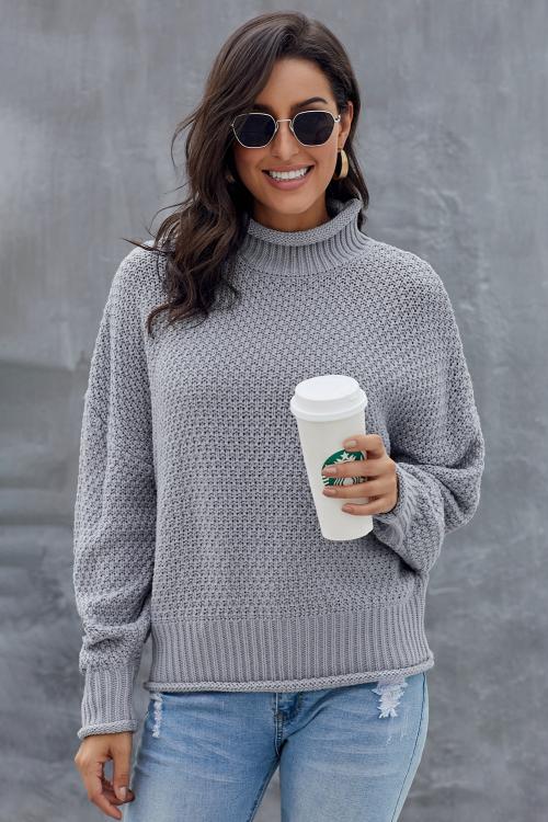 A stylish gray chunky batwing long sleeve turtleneck sweater, showcasing its oversized design and soft fabric, perfect for winter wear.