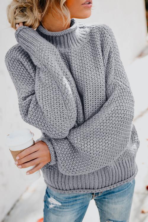 A stylish gray chunky batwing long sleeve turtleneck sweater, showcasing its oversized design and soft fabric, perfect for winter wear.