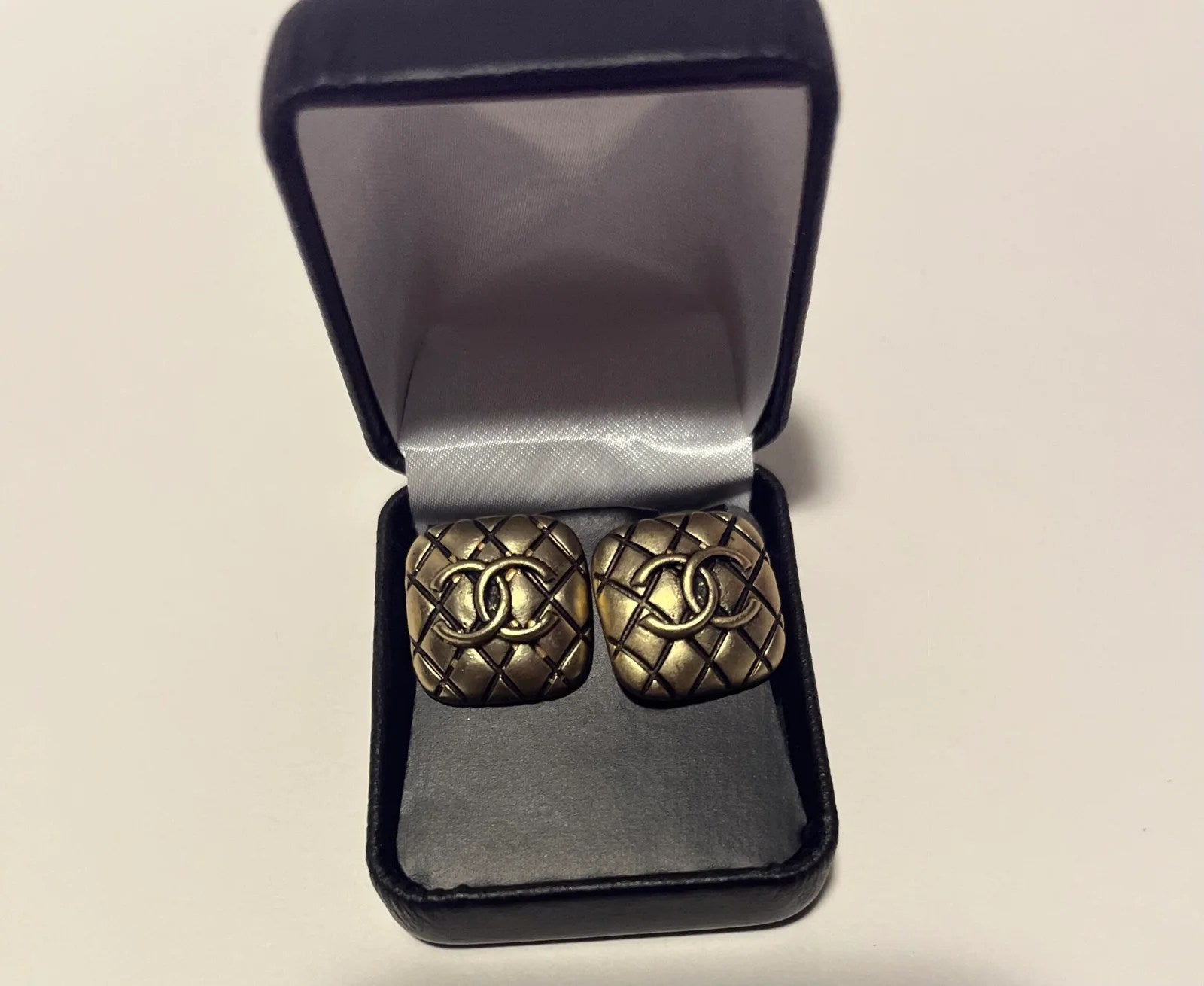 A pair of elegant gold replica earrings, showcasing a stylish design perfect for any occasion.