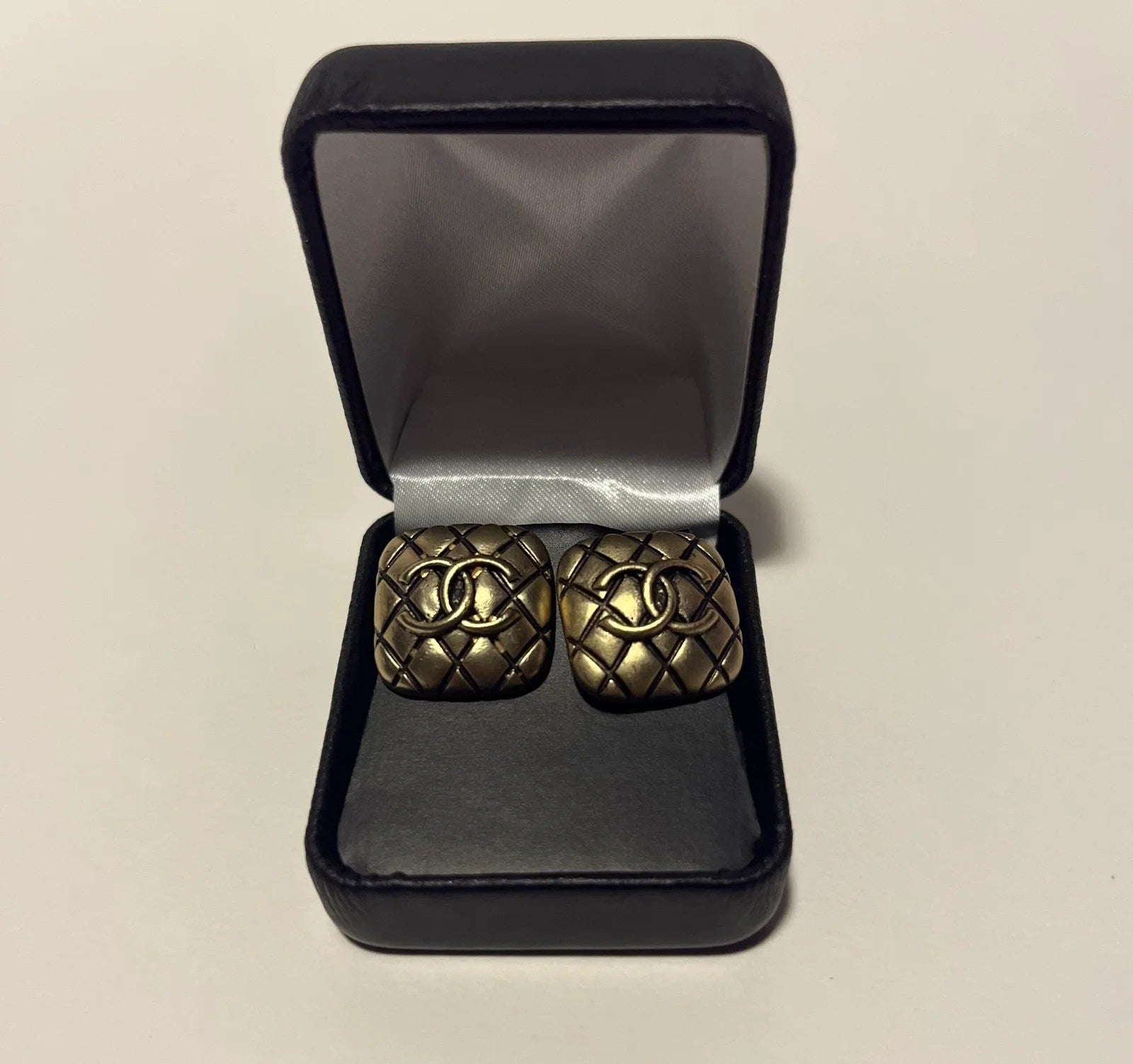 A pair of elegant gold replica earrings, showcasing a stylish design perfect for any occasion.