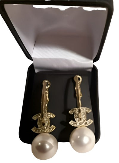 Elegant gold and pearl earrings, high-quality replica, 2 inches in size, perfect for special occasions.