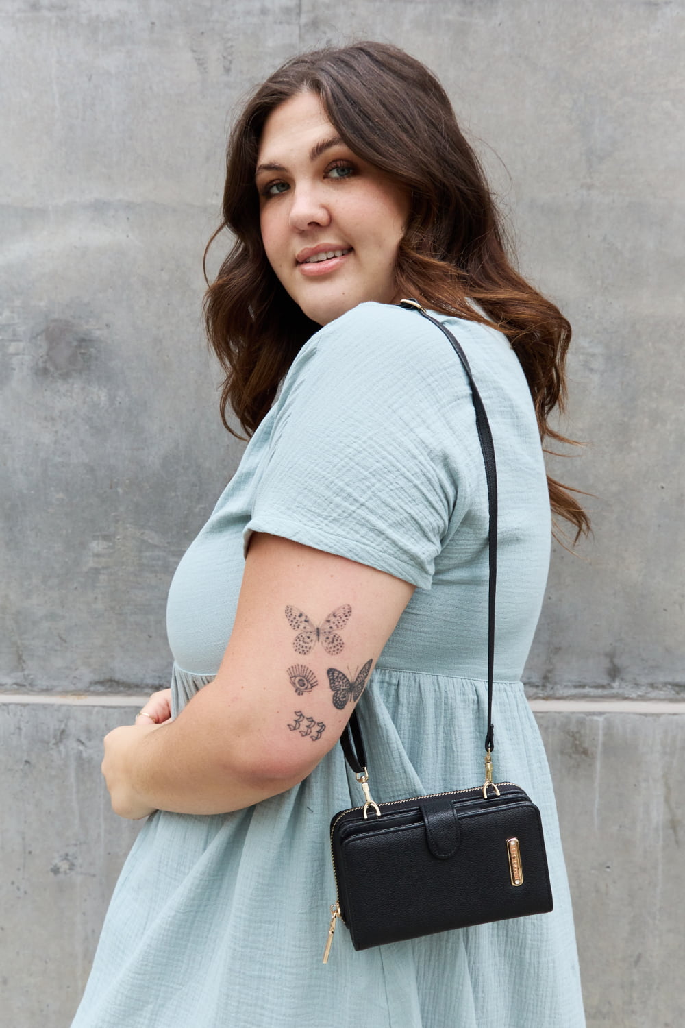 Nicole Lee USA Two-Piece Crossbody Phone Case Wallet in pebbled vegan leather, featuring a universal phone holder and multiple card slots.