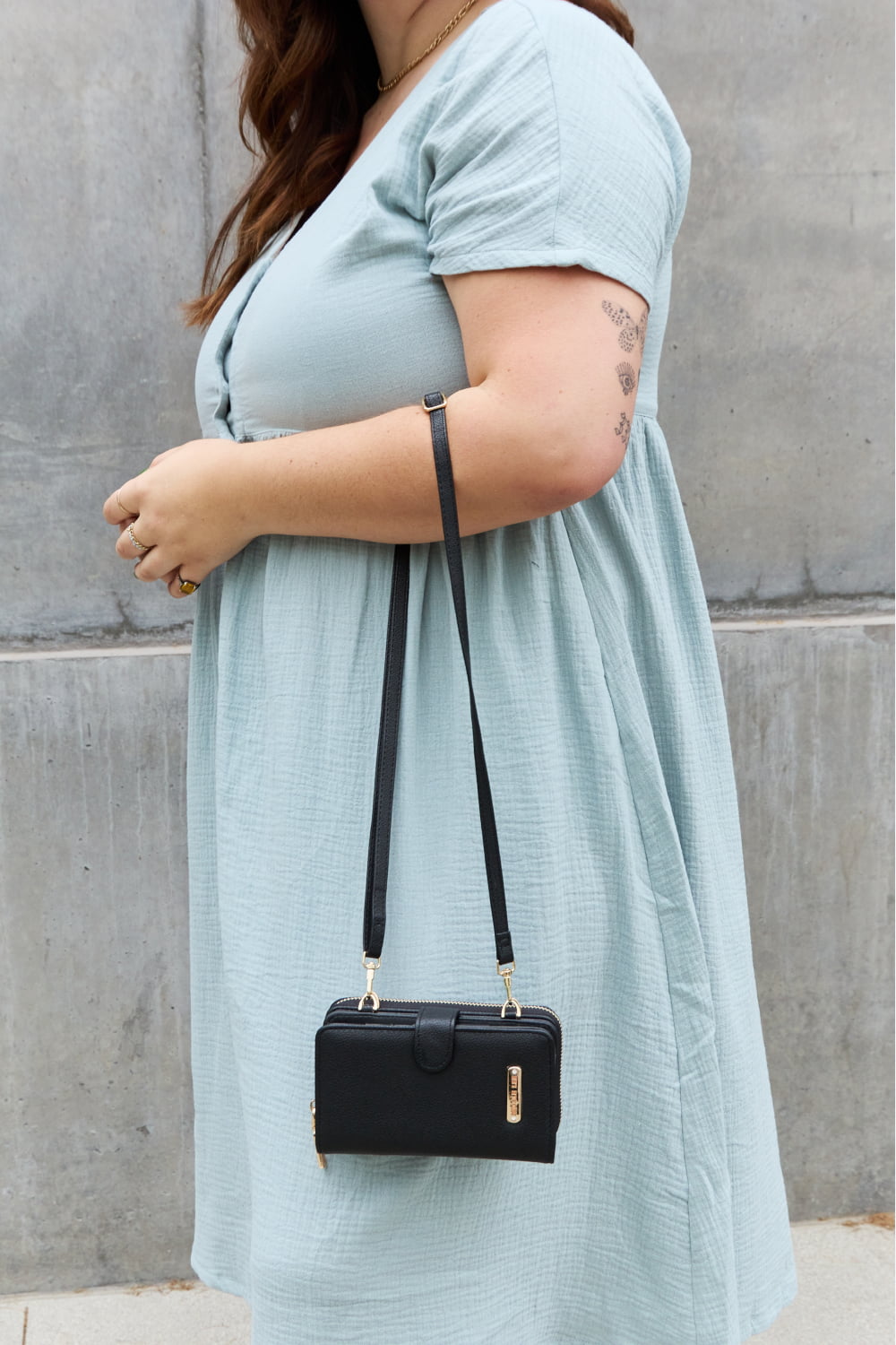 Nicole Lee USA Two-Piece Crossbody Phone Case Wallet in pebbled vegan leather, featuring a universal phone holder and multiple card slots.