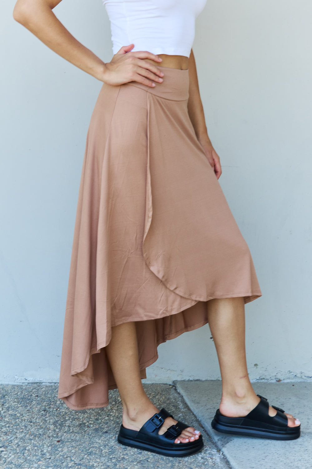 Ninexis First Choice High Waisted Flare Maxi Skirt in Camel, featuring a high-rise waistband and asymmetrical hemline.