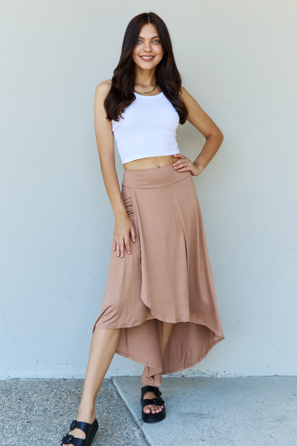 Ninexis First Choice High Waisted Flare Maxi Skirt in Camel, featuring a high-rise waistband and asymmetrical hemline.
