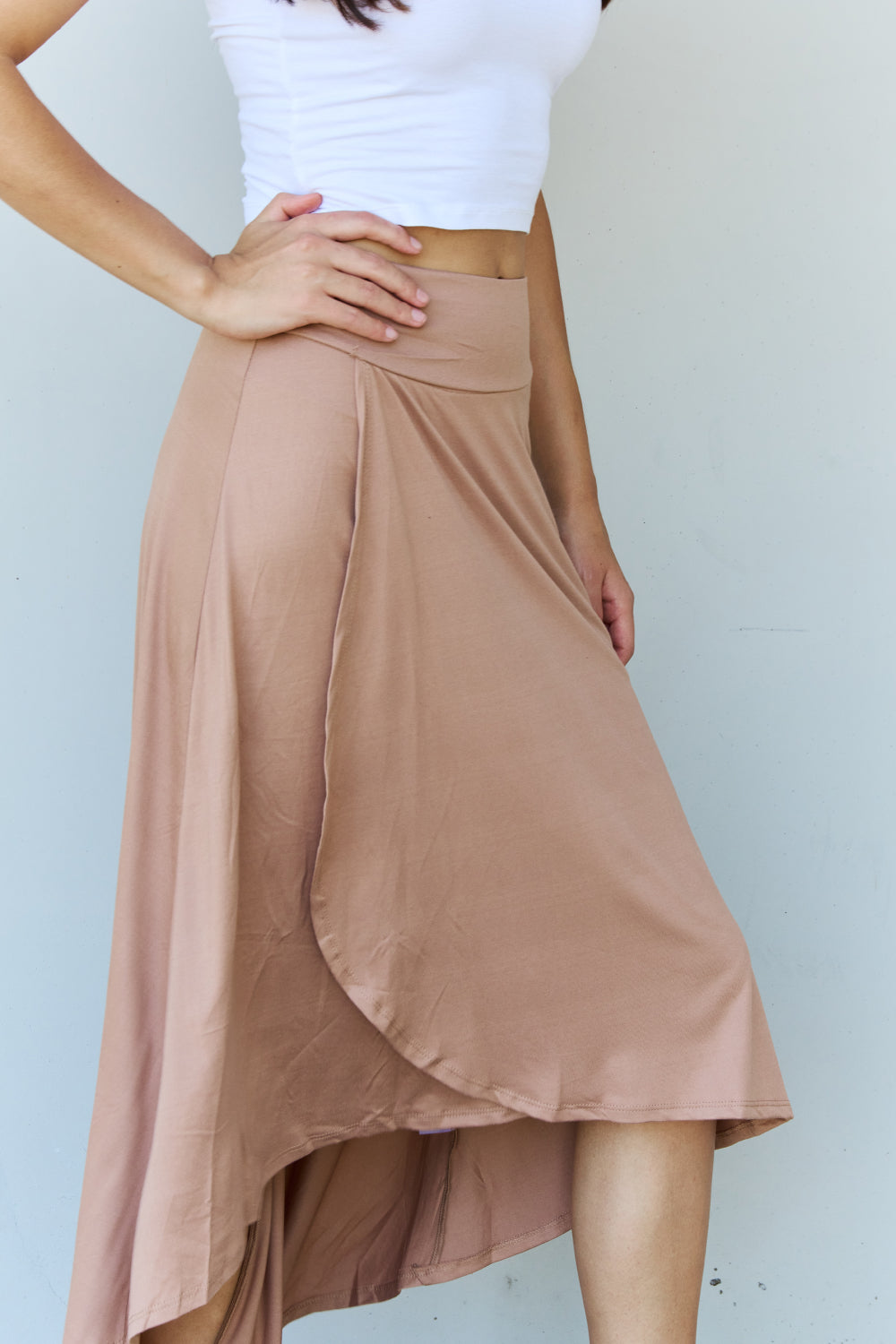 Ninexis First Choice High Waisted Flare Maxi Skirt in Camel, featuring a high-rise waistband and asymmetrical hemline.