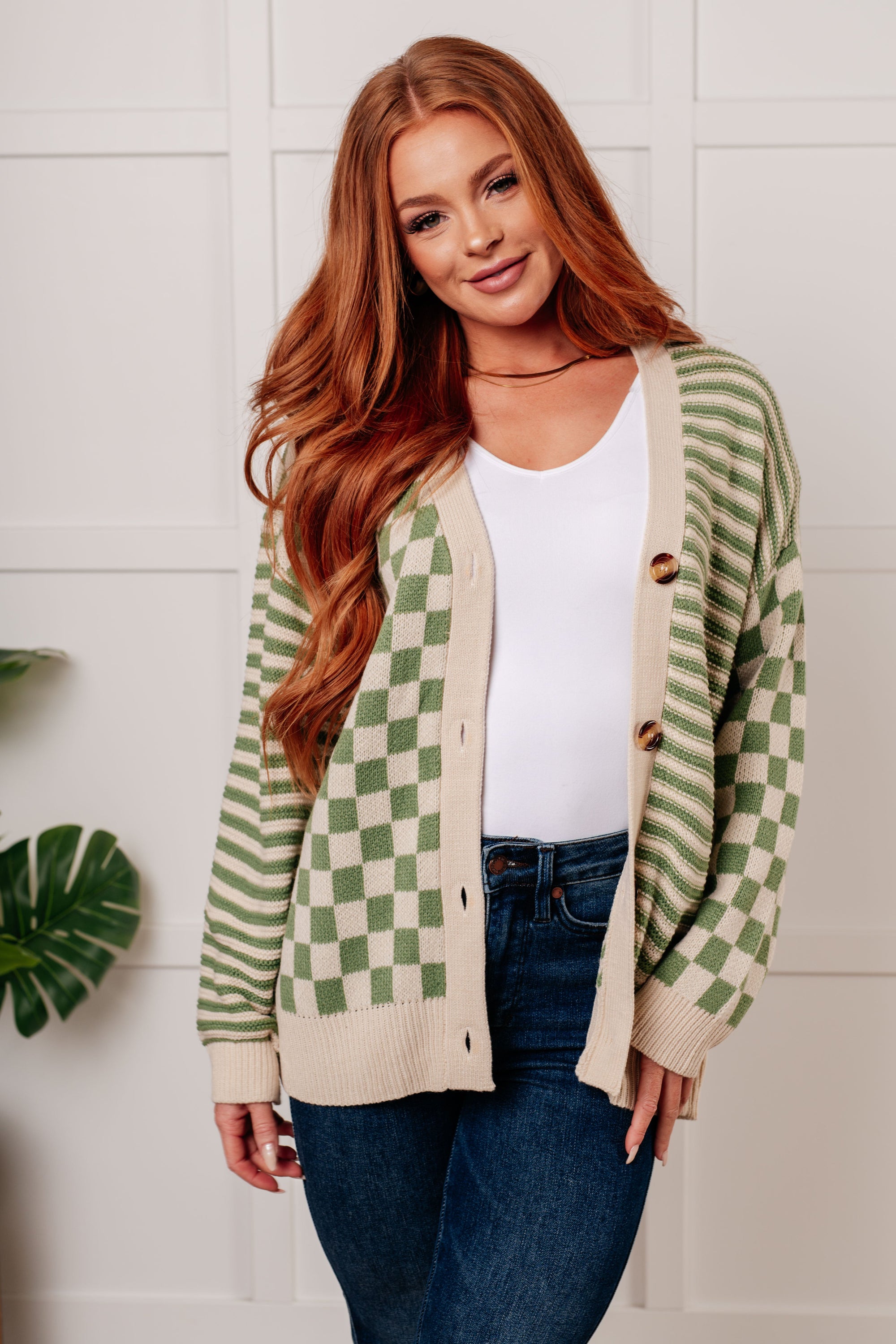 A stylish No Brainer Button Down Sweater Knit Cardigan featuring a V-neckline, button closures, and ribbed details, displayed on a model.
