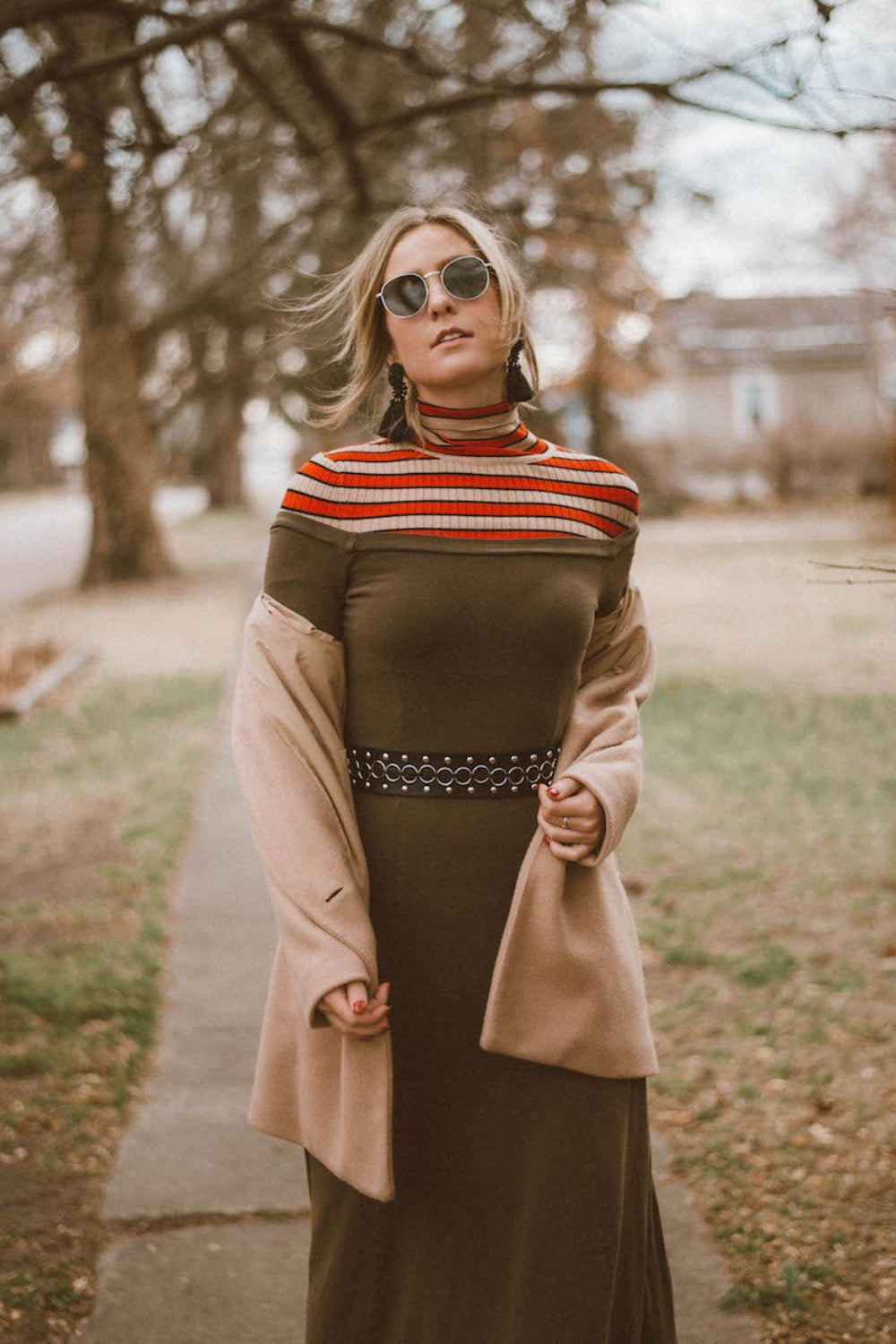 A stylish off the shoulder dress in brown, featuring long sleeves and a midi length, perfect for various occasions.