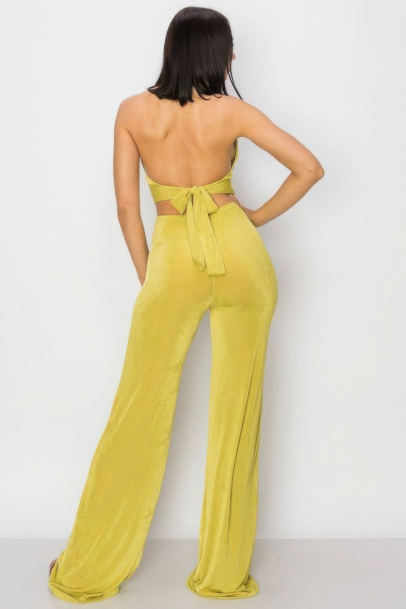 Solid Slinky Wide Legs Jumpsuit in vibrant lime green with modern o-ring detail, showcasing a chic wide-leg silhouette.