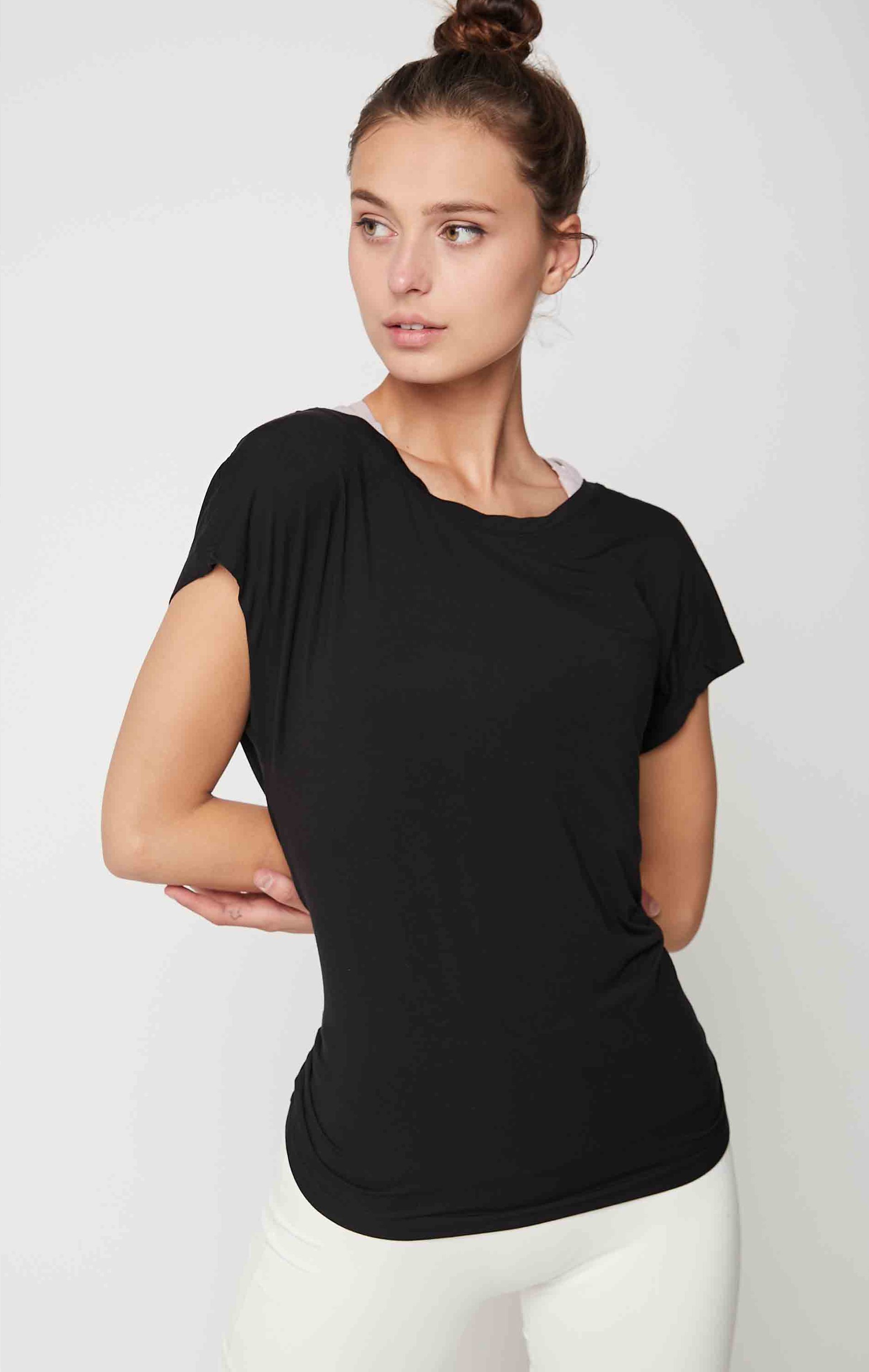 Olivia Modal Short Sleeve Top in Black featuring an open back design and soft fabric, perfect for yoga and casual wear.