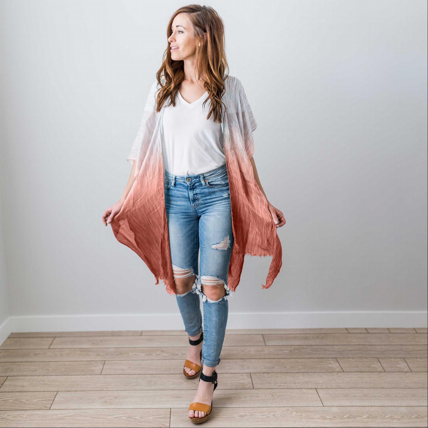 A vibrant ombre vertical multicolor kimono, showcasing a gradient from light to dark hues, perfect for summer styling.