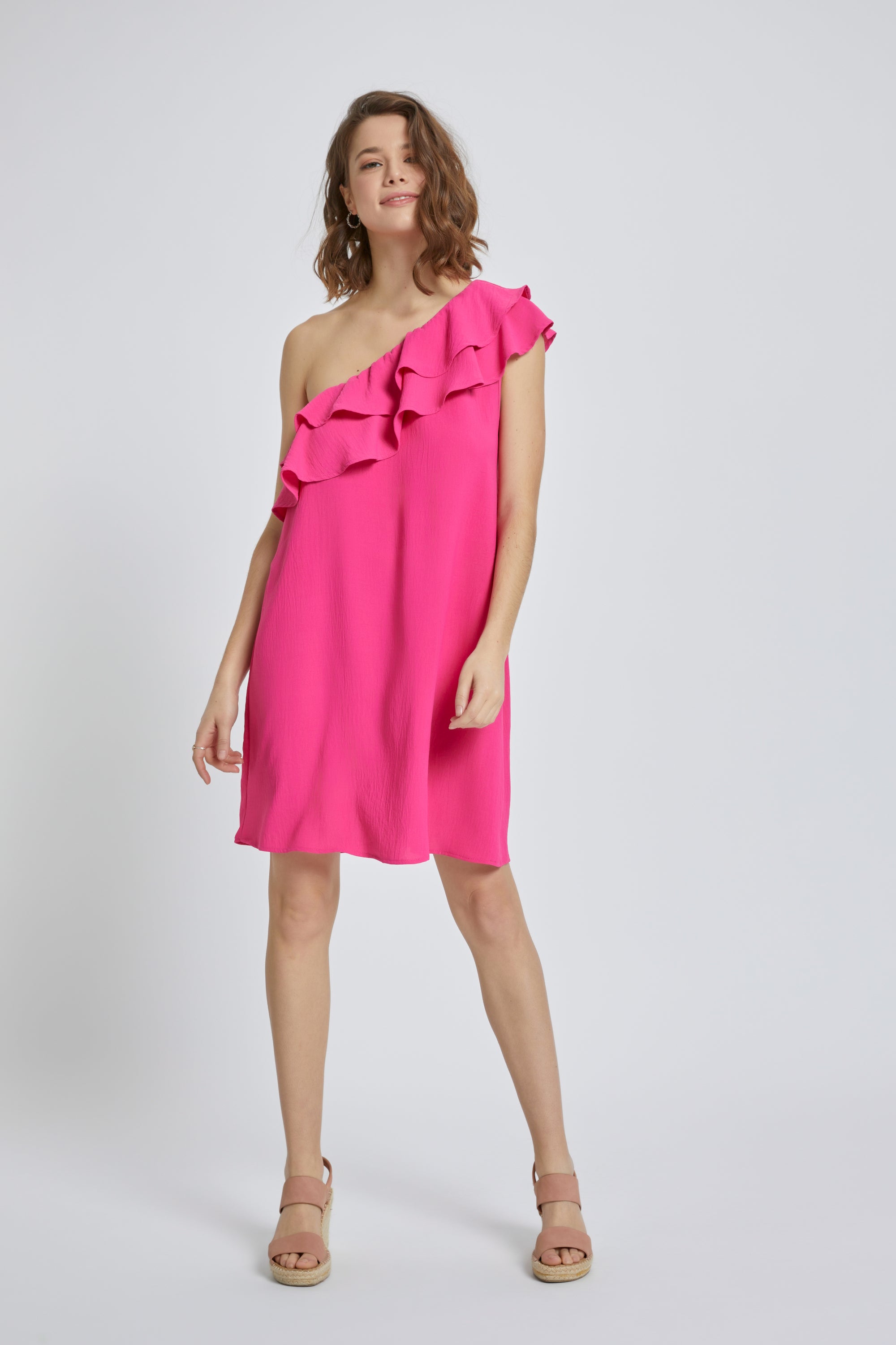 A stylish one-shoulder ruffle mini dress in solid airflow fabric, featuring double-layered ruffles and a loose fit, perfect for summer occasions.