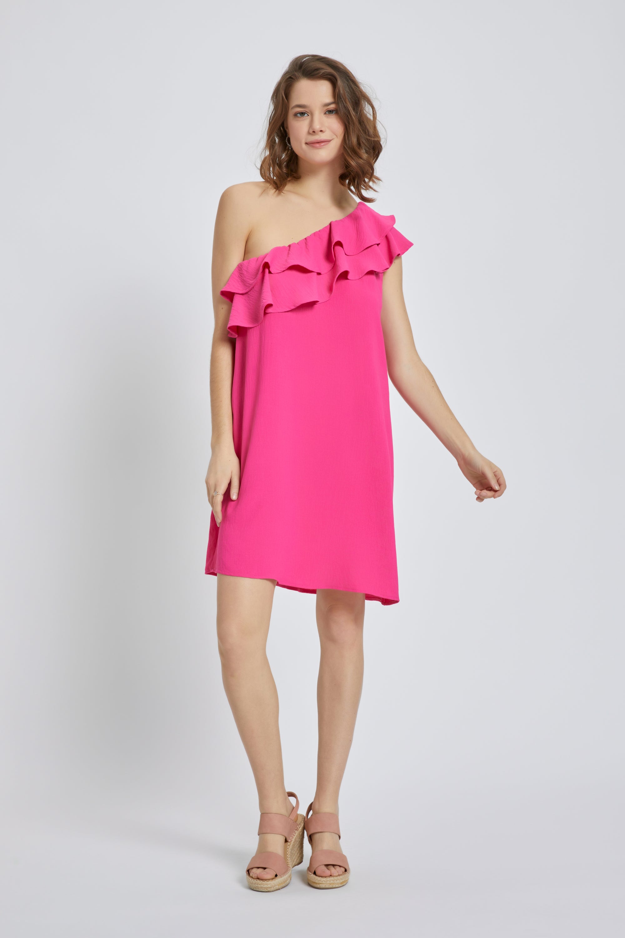 A stylish one-shoulder ruffle mini dress in solid airflow fabric, featuring double-layered ruffles and a loose fit, perfect for summer occasions.