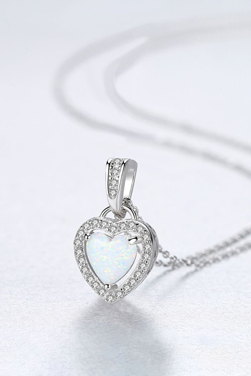 Opal Heart Pendant Necklace made of 925 Sterling Silver, featuring a minimalist design with a beautiful opal centerpiece.