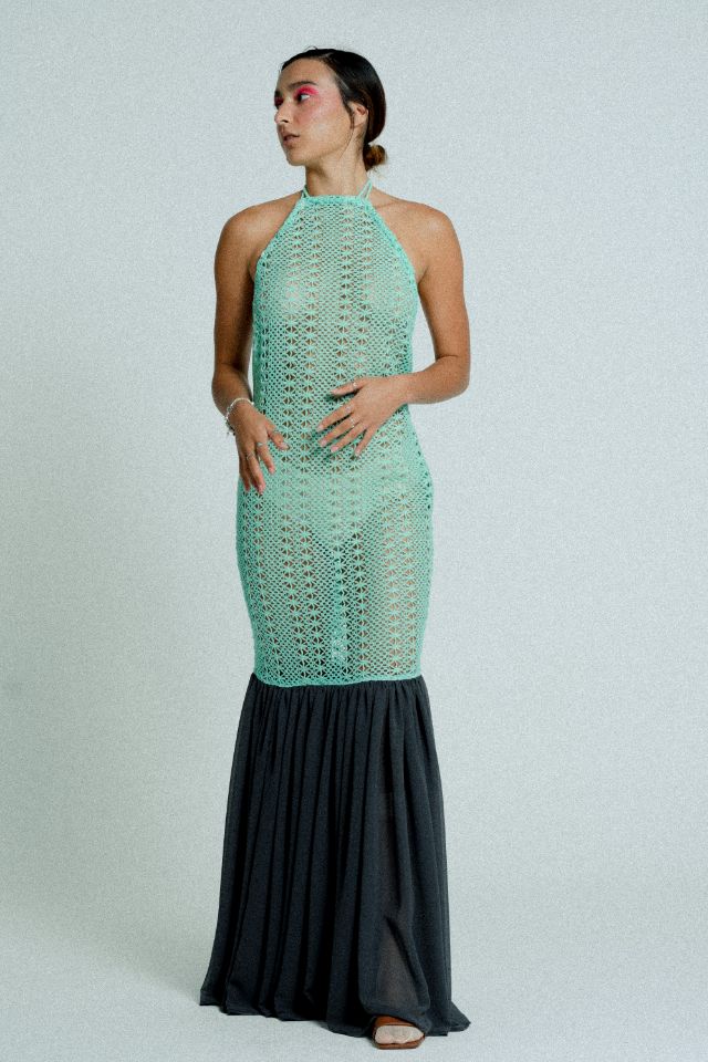 Open back cotton crochet dress in mint green with dark grey chiffon hem, showcasing a body-hugging design and adjustable strings.