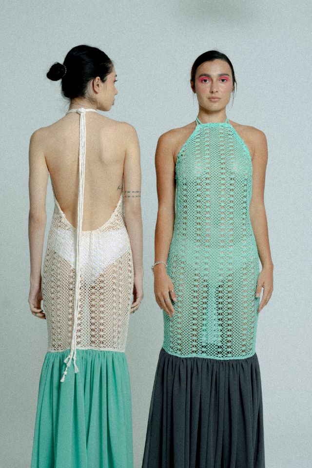 Open back cotton crochet dress in mint green with dark grey chiffon hem, showcasing a body-hugging design and adjustable strings.