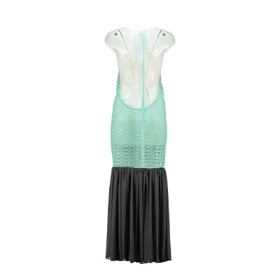Open back cotton crochet dress in mint green with dark grey chiffon hem, showcasing a body-hugging design and adjustable strings.