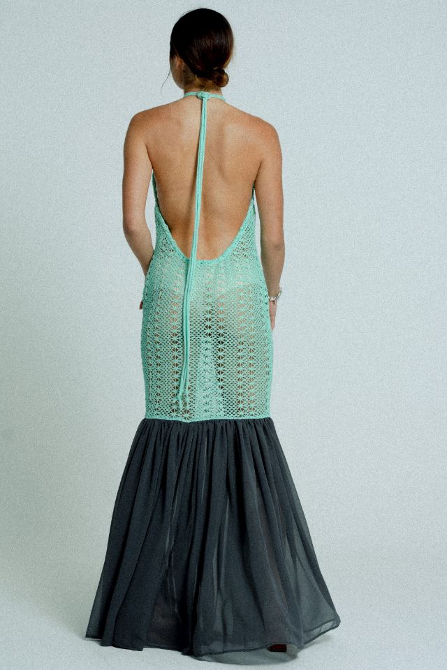 Open back cotton crochet dress in mint green with dark grey chiffon hem, showcasing a body-hugging design and adjustable strings.