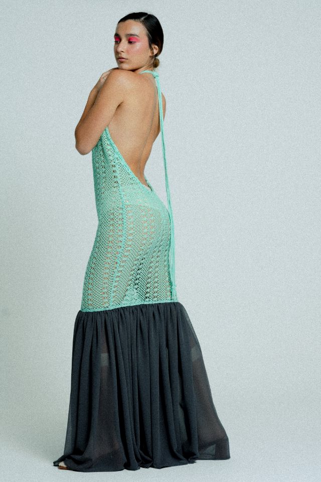 Open back cotton crochet dress in mint green with dark grey chiffon hem, showcasing a body-hugging design and adjustable strings.