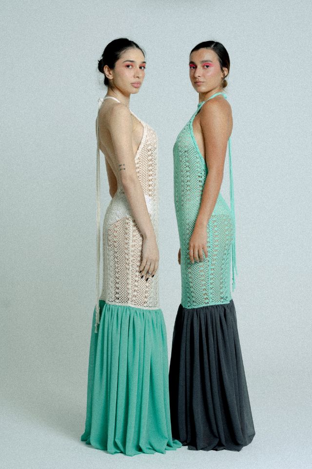 Open back cotton crochet dress in mint green with dark grey chiffon hem, showcasing a body-hugging design and adjustable strings.